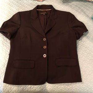 Short sleeved black blazer.